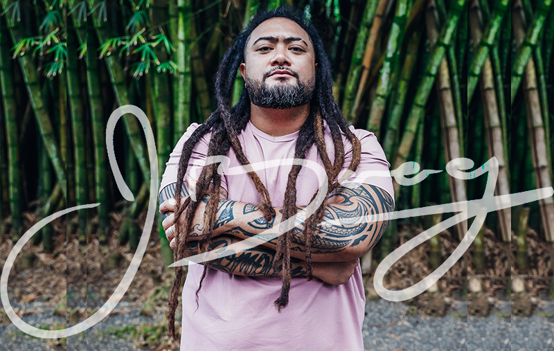 J Boog standing in front of a bamboo grove